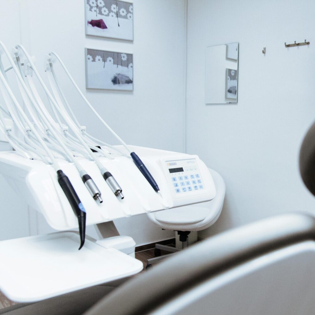 Bright dental office showcasing modern equipment and clean, sleek design.